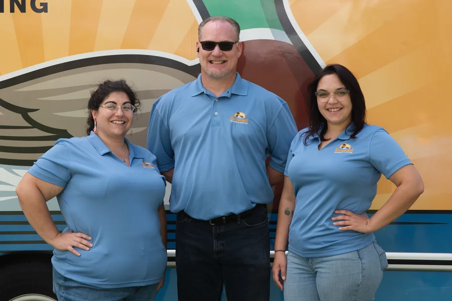 Emerald Heating & Cooling staff posing in front of their service van in Depew, NY, ready for HVAC calls.
