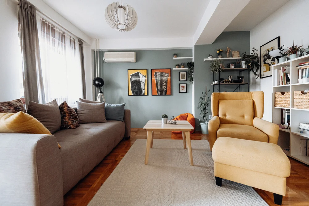 Modern living room with a ductless mini-split AC unit mounted on the wall — a popular cooling solution for Buffalo area homes