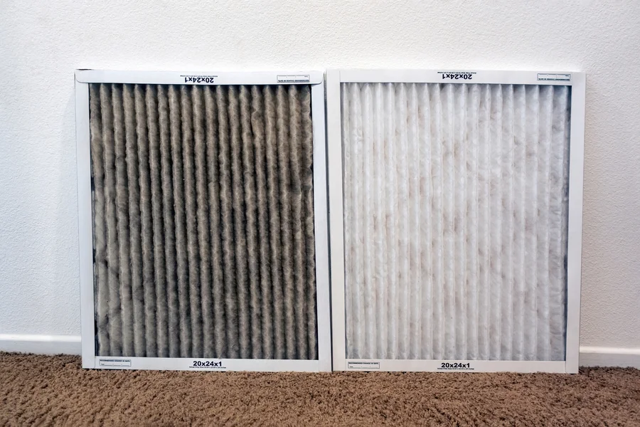 Dirty vs. clean AC filter comparison showing why Buffalo homeowners need regular filter replacement service